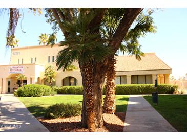 A charming restaurant with lush greenery in the front on a sunny day at 12221 W Bell Rd # 363, Surprise, AZ 85378