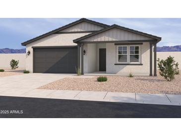 Charming single story home featuring a two car garage and desert landscaping at 16178 W Bajada Rd, Surprise, AZ 85387
