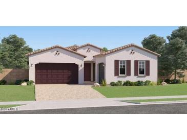 Charming single-story home featuring a two-car garage, neutral color palette, and well-maintained landscaping at 23244 W Tamarisk Ave, Buckeye, AZ 85326
