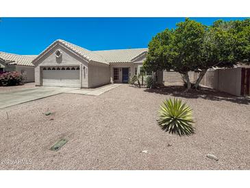 Charming single-story home featuring desert landscaping and a two-car garage at 4332 E Stanford Ave, Gilbert, AZ 85234