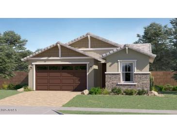 Charming single-story home featuring a two-car garage and manicured lawn at 4963 S 233Rd Dr, Buckeye, AZ 85326