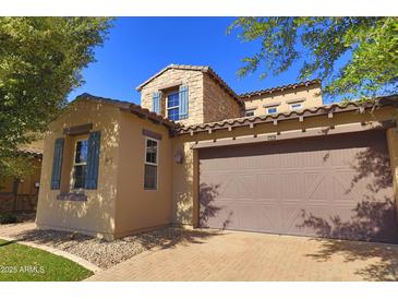 Charming home showcasing two-car garage, desert landscaping, and a blend of stone and stucco at 3581 S Arizona Pl, Chandler, AZ 85286