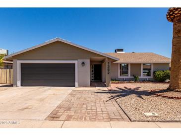 Charming single-story home featuring a well-maintained yard and a convenient two-car garage at 1352 W Naranja Ave, Mesa, AZ 85202