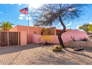 Charming single story home featuring desert landscaping, a courtyard, and a gated entrance at 2843 E Captain Dreyfus Ave, Phoenix, AZ 85032