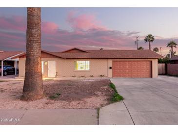 Charming single-story home with a two-car garage and a well-maintained front yard, perfect for suburban living at 3513 W Maryland Ave, Phoenix, AZ 85019