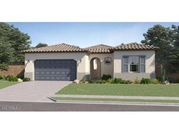 Charming single-story home with tile roof, lush green lawn, and two-car garage at 14949 W Cottontail Ln, Surprise, AZ 85387
