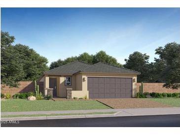 Charming single-story home with desert landscaping and a two-car garage, perfect for modern living at 23219 W Marguerite Ave, Buckeye, AZ 85326