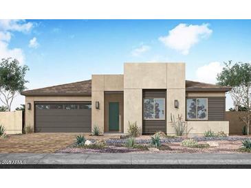 Contemporary single-story home with desert landscaping, attached garage and modern curb appeal at 2594 E Tapenade Dr, San Tan Valley, AZ 85140