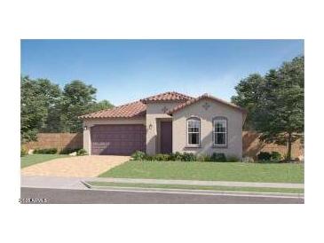Charming single-story home featuring a tile roof, arched windows, manicured lawn, and a two-car garage at 4924 S 232Nd Ln, Buckeye, AZ 85326