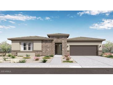 Charming single-story home with desert landscaping, brick accents, and a two-car garage at 14187 W Soft Wind Cir, Surprise, AZ 85387