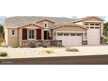 Charming single-story home featuring a three car garage and beautiful desert landscaping at 19560 E Estrella Rd, Queen Creek, AZ 85142