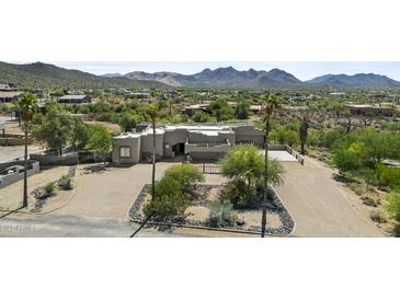 Stunning aerial view of a custom home with desert landscaping and mountain views at 38709 N 16Th Pl, Phoenix, AZ 85086