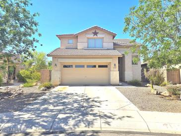 Two-story home with desert landscaping, and a two-car garage at 44583 W Sandstone Dr, Maricopa, AZ 85139