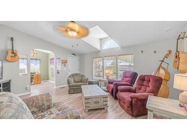 Inviting living room features lots of light and comfortable seating, perfect for relaxing and entertaining guests at 2400 E Baseline Ave # 44, Apache Junction, AZ 85119