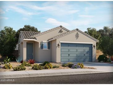 Charming single-story home featuring a two-car garage, desert landscaping, and tile roof at 323 S San Christo Ln, Casa Grande, AZ 85194