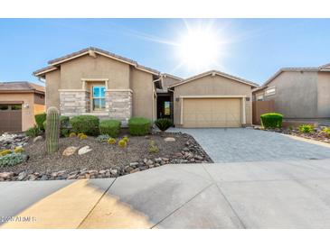 Charming home featuring desert landscaping and a neutral color palette at 23448 N 76Th Pl, Scottsdale, AZ 85255