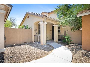 Inviting front exterior showcasing a charming porch and desert landscaping for low-maintenance appeal at 2715 N 73Rd Dr, Phoenix, AZ 85035