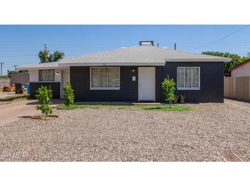 Charming single-story home featuring a freshly painted exterior and well-maintained front yard at 1527 W Roma Ave, Phoenix, AZ 85015
