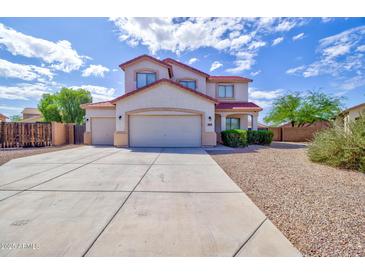 Inviting two-story home featuring a three-car garage and a well-maintained, low-maintenance desert landscape at 1789 E Desert Breeze Pl, Casa Grande, AZ 85122