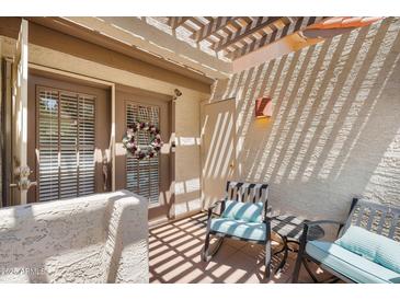 Charming patio area with seating and a pergola, creating a cozy outdoor space at 2333 E Southern Ave # 2016, Tempe, AZ 85282