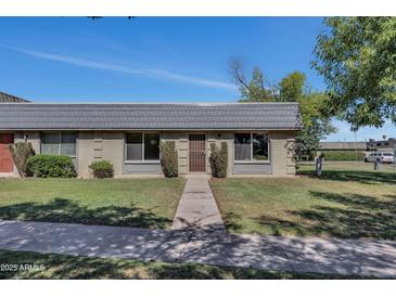 Charming single-story home with well-maintained front yard and quaint entry way at 4752 N 20Th Ave, Phoenix, AZ 85015