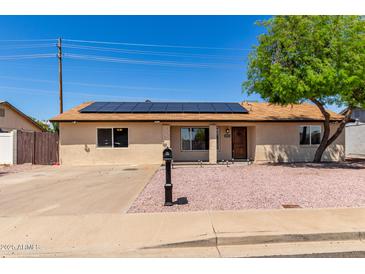 Charming single-story home featuring a low maintenance yard and solar panels at 4134 W Camino Acequia --, Phoenix, AZ 85051