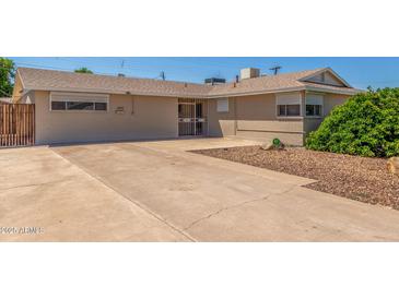 Charming single-story home featuring a long driveway and neutral-toned exterior at 4553 N 54Th Ave, Phoenix, AZ 85031