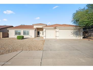 Charming single-story home with a terra cotta roof, low-maintenance yard, and an attached two-car garage at 6805 S 14Th St, Phoenix, AZ 85042