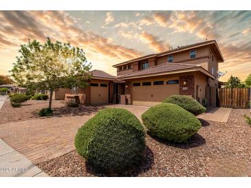 Stunning two-story home with a three-car garage and professionally landscaped front yard at 3338 E Coconino Dr, Gilbert, AZ 85298