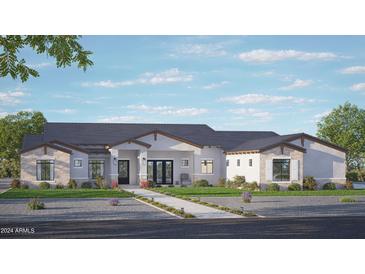Stunning single-story home with stone accents, a modern design, and a beautifully landscaped front yard at 3734 E Weston Ln, San Tan Valley, AZ 85140