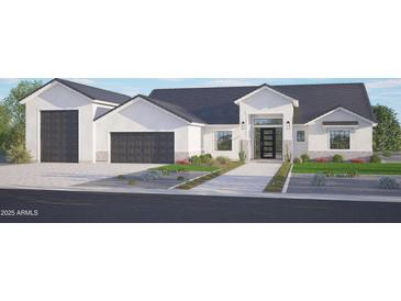 Charming single-story home featuring a three-car garage, modern design, and desert landscaping at 3782 E Weston Ln, San Tan Valley, AZ 85140