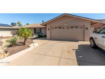 Charming single-story home with a two-car garage, desert landscaping and inviting curb appeal at 3529 W Saint Moritz Ln, Phoenix, AZ 85053