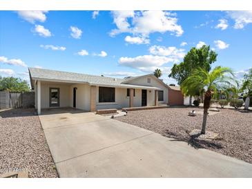 Charming single-story home with a long driveway and low-maintenance desert landscaping at 414 E Westchester Dr, Tempe, AZ 85283