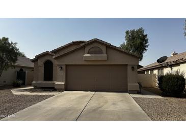 Charming single-story home featuring desert landscaping and a two-car garage with a neutral color scheme at 515 E Sherri Dr, Gilbert, AZ 85296