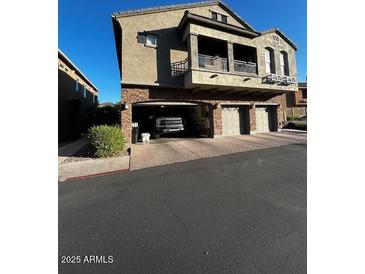 Three-story condo with a three-car garage and private balcony at 1350 S Greenfield Rd # 1219, Mesa, AZ 85206