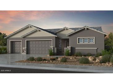 Charming single-story home featuring a three-car garage and neutral color palette at 18924 E Celtic Manor Dr, Queen Creek, AZ 85142