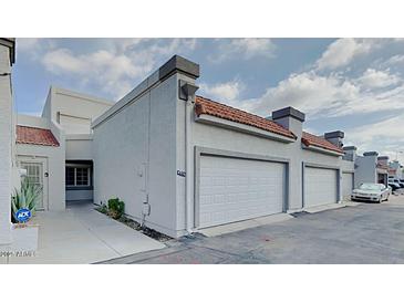 Charming townhome with two-car garage and well-maintained stucco exterior at 4776 W Eva St, Glendale, AZ 85302