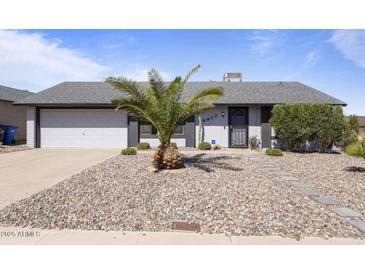 Charming single-story home featuring a xeriscaped yard and a well-maintained exterior at 6802 S 44Th Pl, Phoenix, AZ 85042