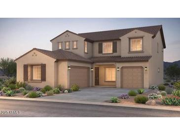 Beautiful two-story home with well-manicured landscaping and a spacious two-car garage at 16717 W Questa Dr, Surprise, AZ 85387