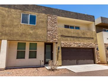 Modern two-story home featuring mixed stone and stucco facade and a large two-car garage at 2000 N 36Th St # 10, Phoenix, AZ 85008