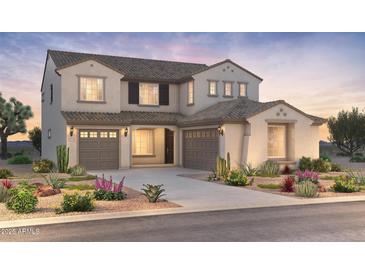 Inviting two-story home with a three-car garage, desert landscaping, and a neutral color palette at 7131 W Oberlin Way, Peoria, AZ 85383