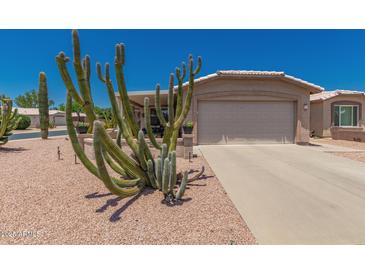 Charming home with a well-maintained desert landscaped front yard and a two-car garage at 1362 E Cherry Hills Dr, Chandler, AZ 85249