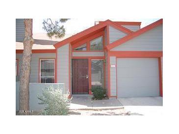 Charming home exterior with red trim and a well-maintained front yard at 14002 N 49Th Ave # 1021, Glendale, AZ 85306