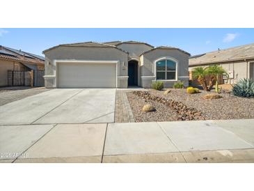 Charming single-story home featuring low-maintenance desert landscaping and a two car garage at 13529 W Remuda Dr, Peoria, AZ 85383