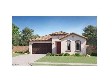Charming single-story home featuring a tile roof, stucco walls, and a well-maintained front lawn at 17490 W Victory St, Goodyear, AZ 85338