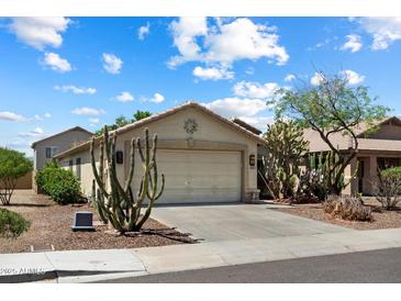 Charming single-story home featuring a two-car garage, desert landscaping, and a welcoming facade at 6205 W Encinas Ln, Phoenix, AZ 85043