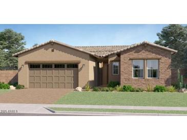 Charming single-story home with a well-maintained lawn and a two-car garage at 7848 W Tether Trl, Peoria, AZ 85383