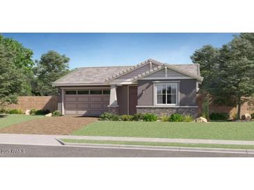 Charming single-story home with a well-manicured lawn and a two-car garage at 23113 E Saddle Way, Queen Creek, AZ 85142