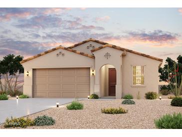 Charming single-story home with a two-car garage and low-maintenance desert landscaping at 2182 S 246Th Ln, Buckeye, AZ 85326