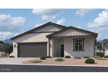 Charming single-story home featuring a two-car garage and low-maintenance landscaping at 24105 W Bowker St, Buckeye, AZ 85326